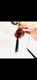 A Scarlet Tribute Car Accessory and Poppy Pin