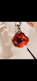 A Scarlet Tribute Car Accessory and Poppy Pin