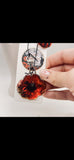 A Scarlet Tribute Car Accessory and Poppy Pin