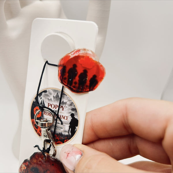 A Scarlet Tribute Car Accessory and Poppy Pin