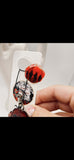 A Scarlet Tribute Car Accessory and Poppy Pin
