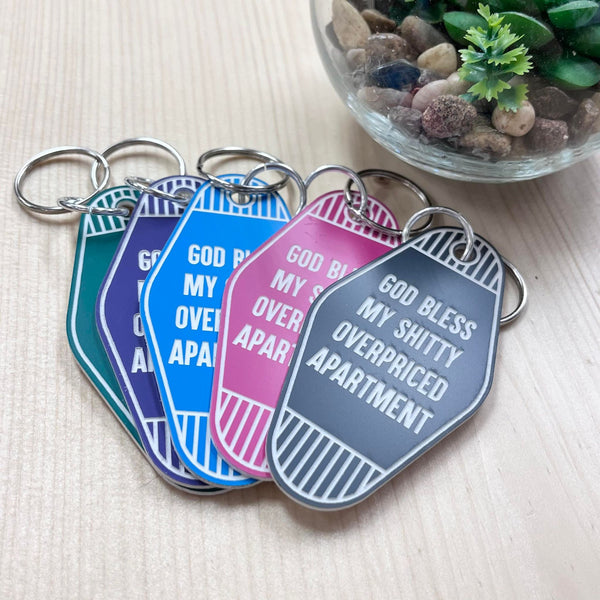 God Bless My Shitty Overpriced Apartment Motel Keychain
