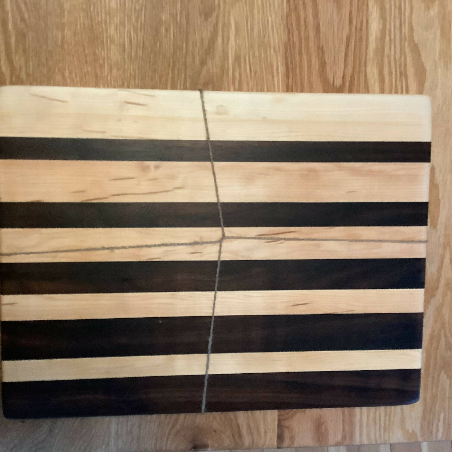 12” x 12” maple and walnut cutting board in gradient pattern