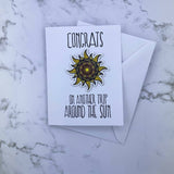 Congrats- Around the Sun Stickard (Greeting Card with Sticker)