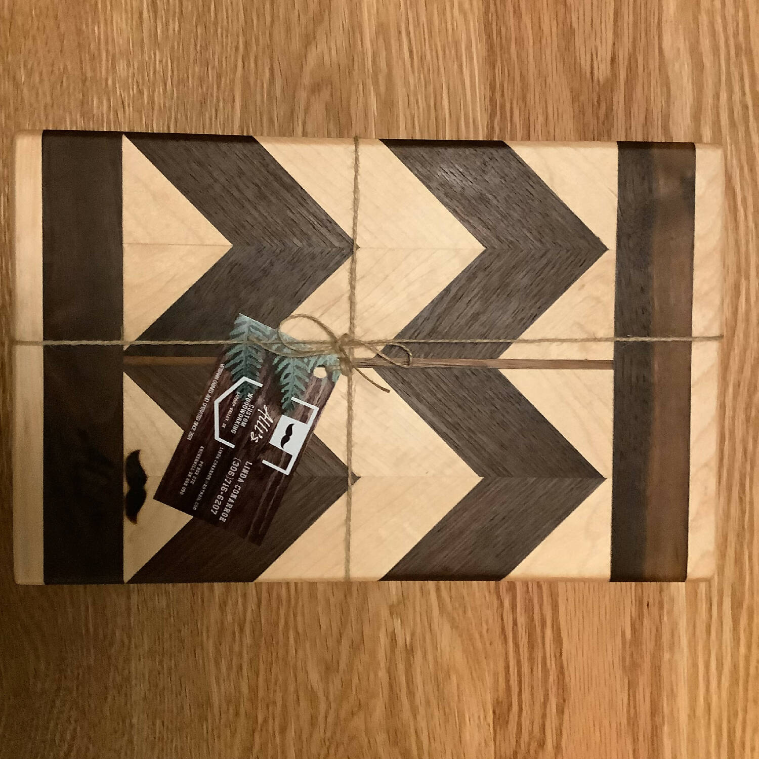 12” x 7.5” chevron pattern walnut and maple cutting board