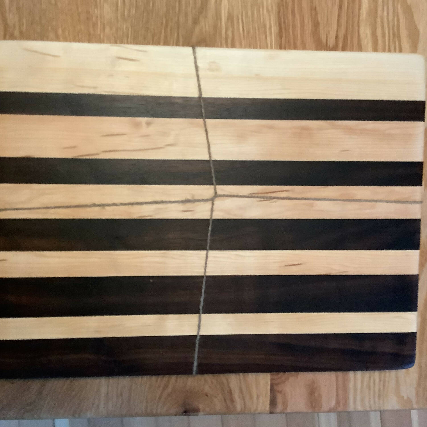 16” x 12” maple and walnut cutting board in gradient pattern
