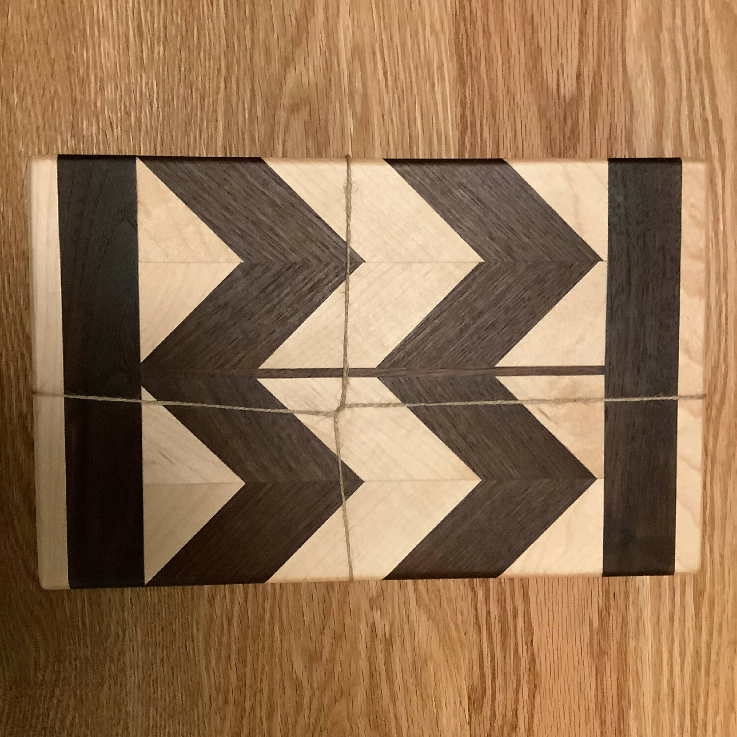 12” x 7.5” chevron pattern walnut and maple cutting board