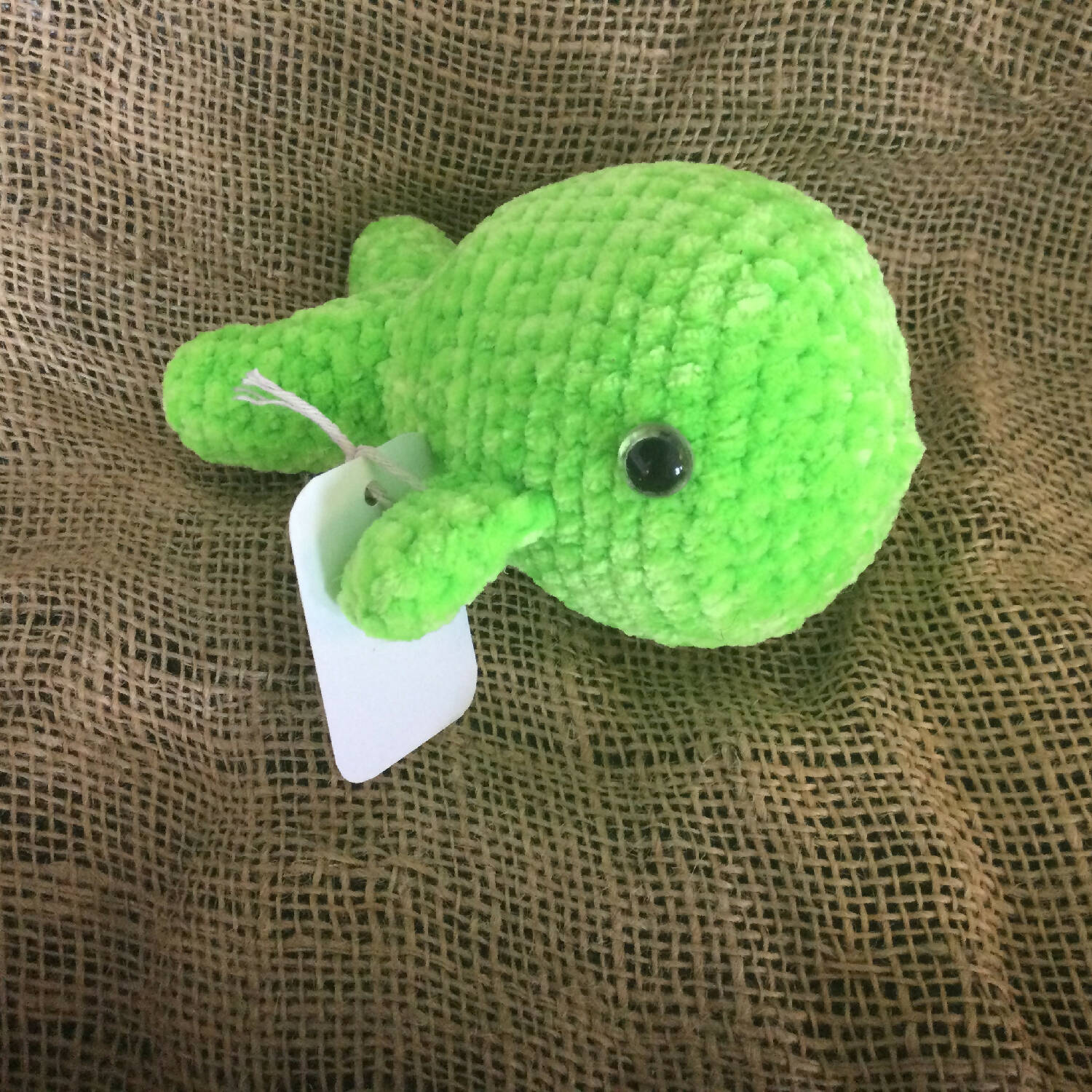 Neon green whale plushie