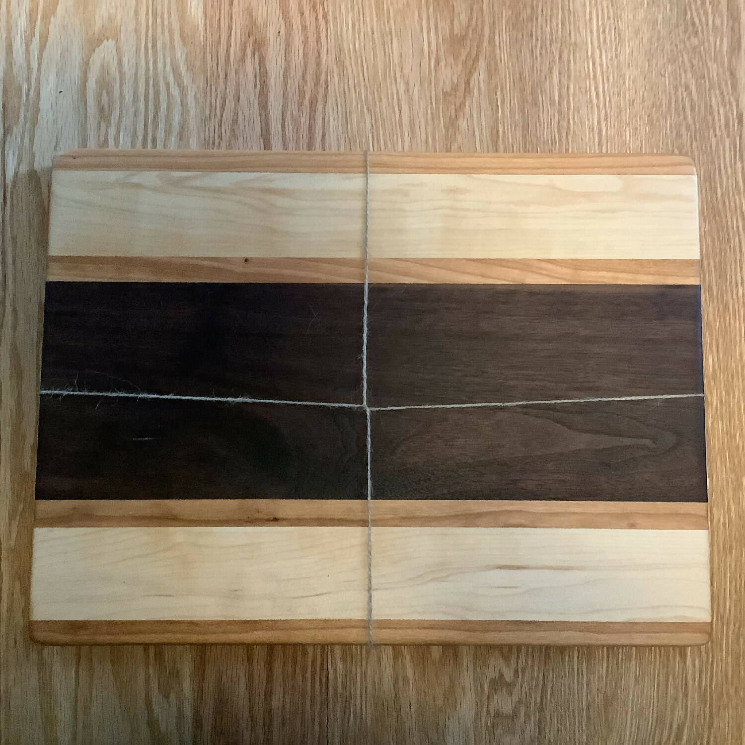 12” x 16” cutting board, walnut with cherry and maple stripes