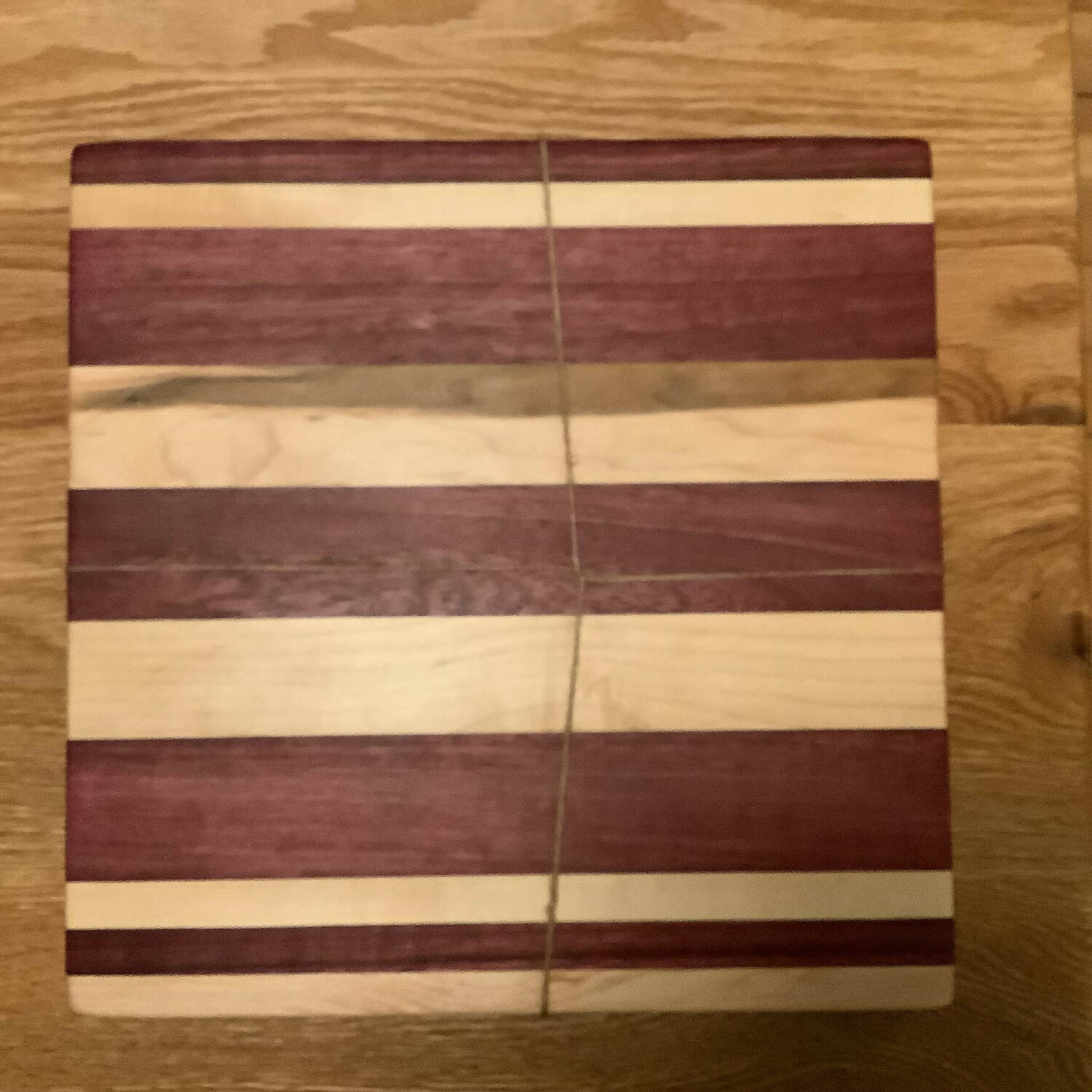 12”x12” maple cutting board with purple heart stripes